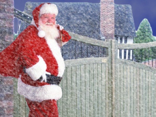 Father Christmas in front of wooden gate | Gate Safe